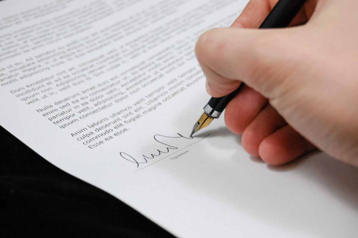 Signing a document with a fountain pen