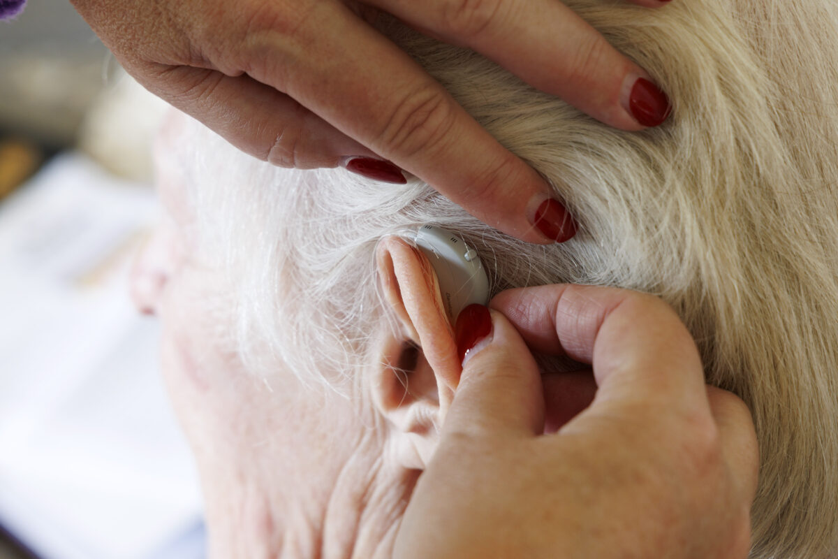 Person having a hearing aid fitted